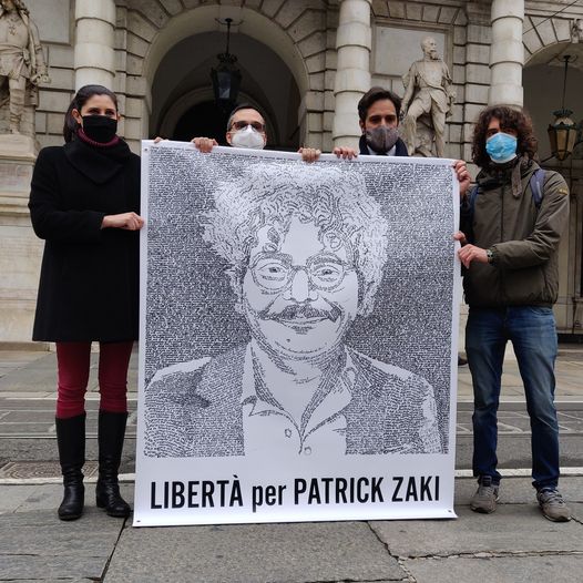 Il volto di Patrick Zaki sulla facciata di Palazzo Civico